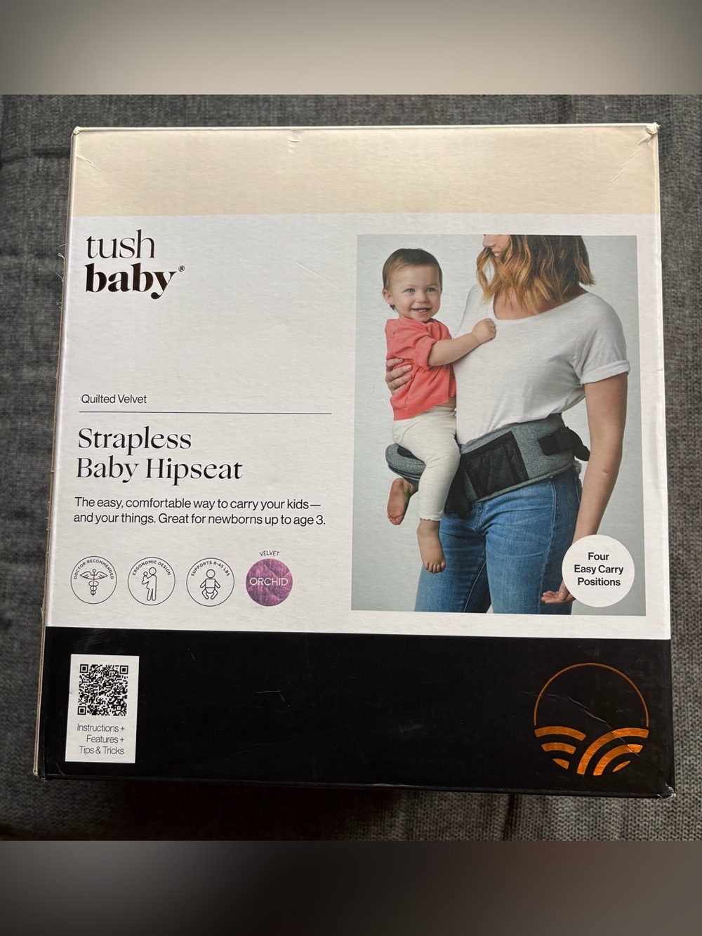 Tushbaby Strapless Baby Hipseat in orchid with embroidered pink carrying strap